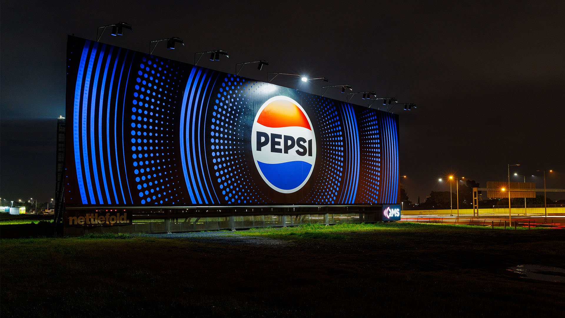 QMS Billboard displaying Pepsi ad on Tullamarine Freeway in Melbourne.